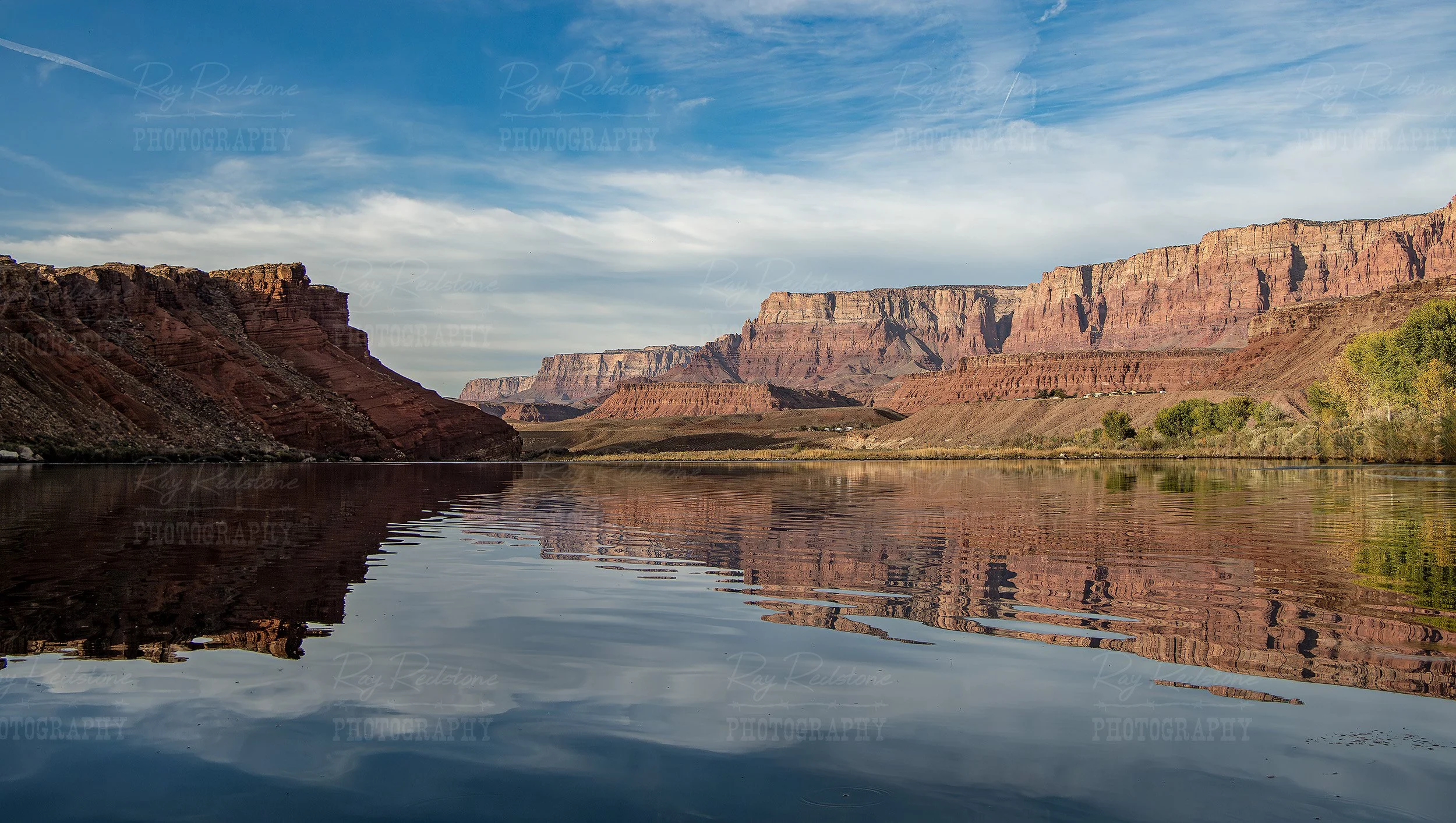 stunning red rock reflections on the Colorado river lees ferry a