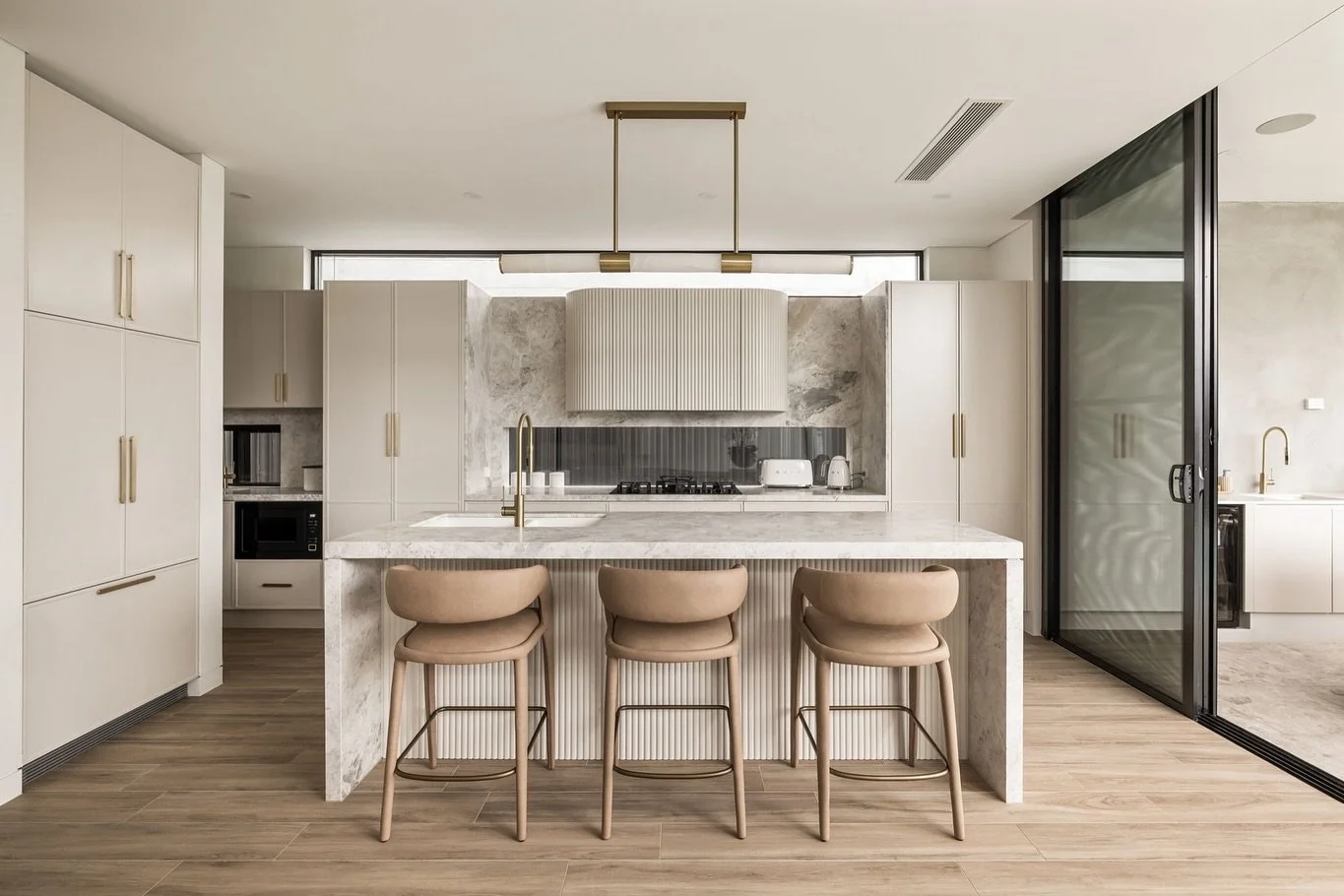 Home Tour: This newly listed family haven is all about scale, light, and finishes.💫

The kitchen, equally chic as it is functional, anchors the home, while open living spaces spill out to a tropical poolside terrace &mdash; complete with an alfresco
