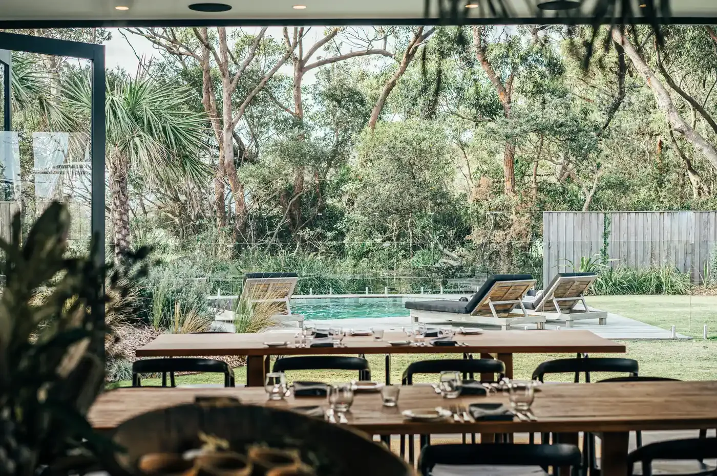 bangalay-luxury-villas-pergola-dining-pool-view.webp