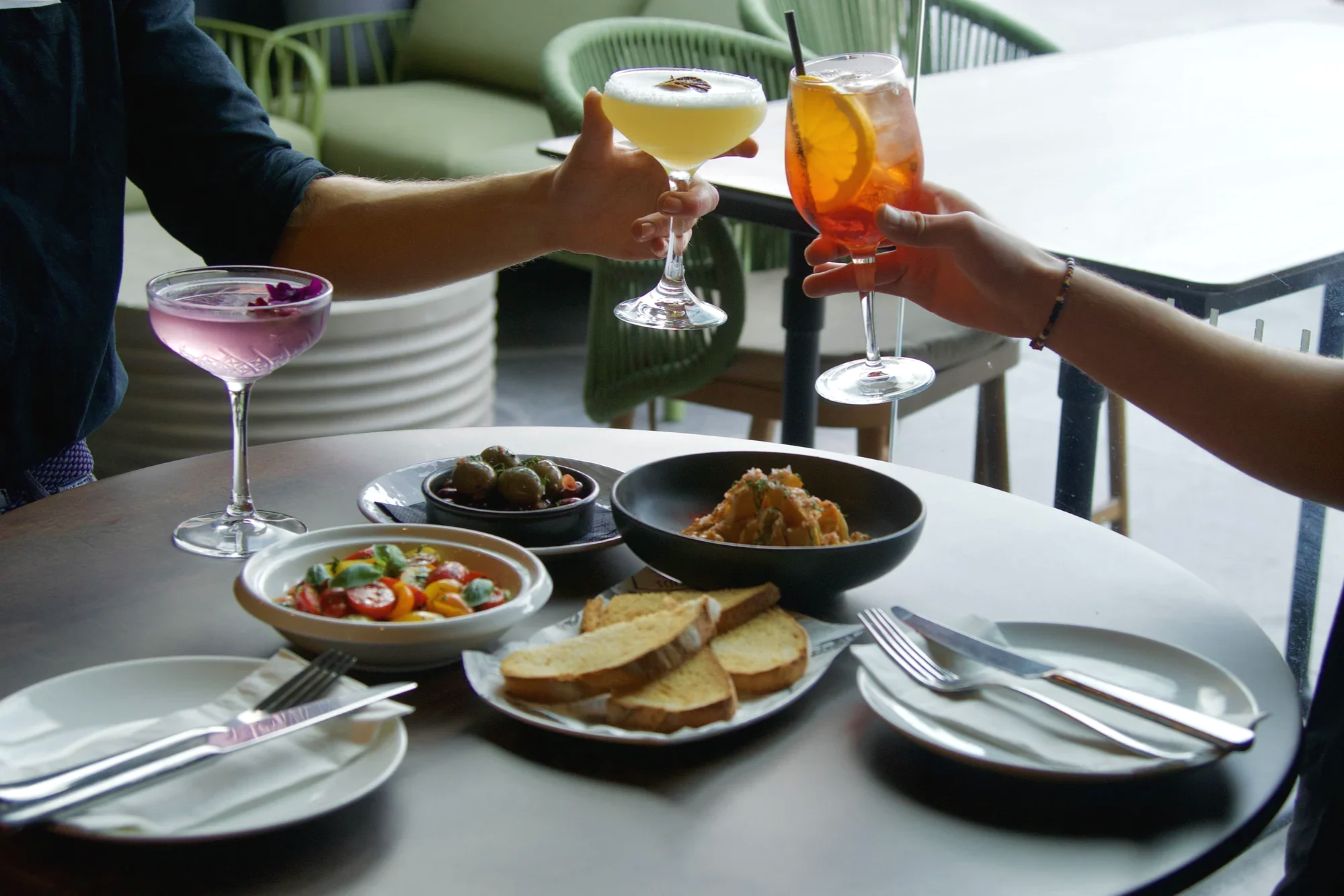 Bottomless lunch table setting at Croydan Lane, Cronulla, with a lineup of cocktails including an Aperol  spritz and margarita