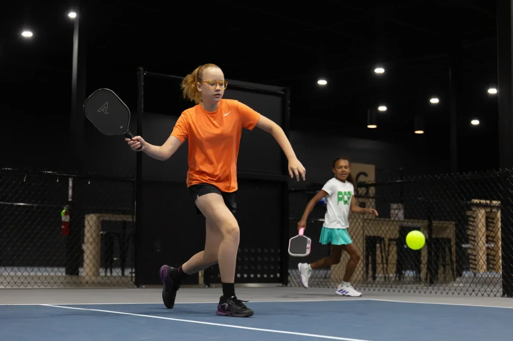 Junior pickleball players in action on an indoor court at The Picklr Cronulla