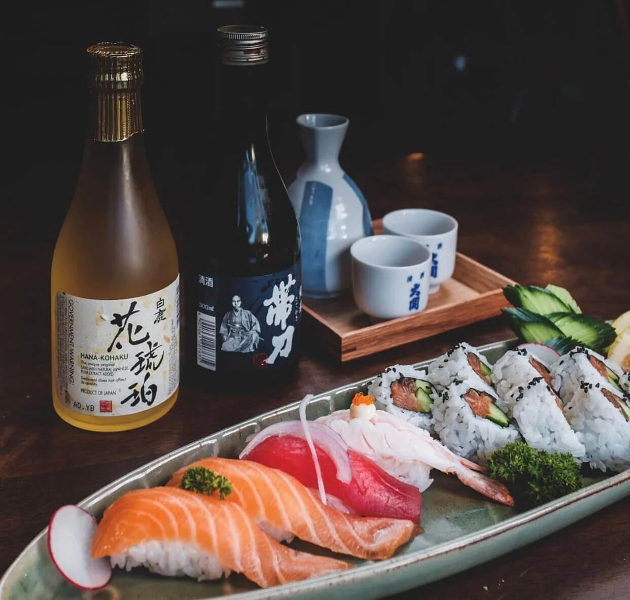 platter of sushi and nigiri with japanese sake