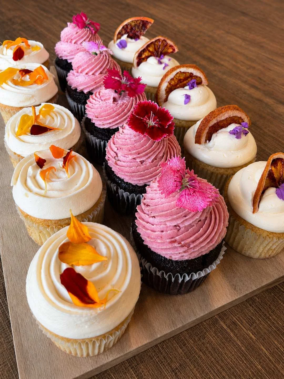 Decorated cupcakes with edible flowers at Baked Patisserie, Kirrawee