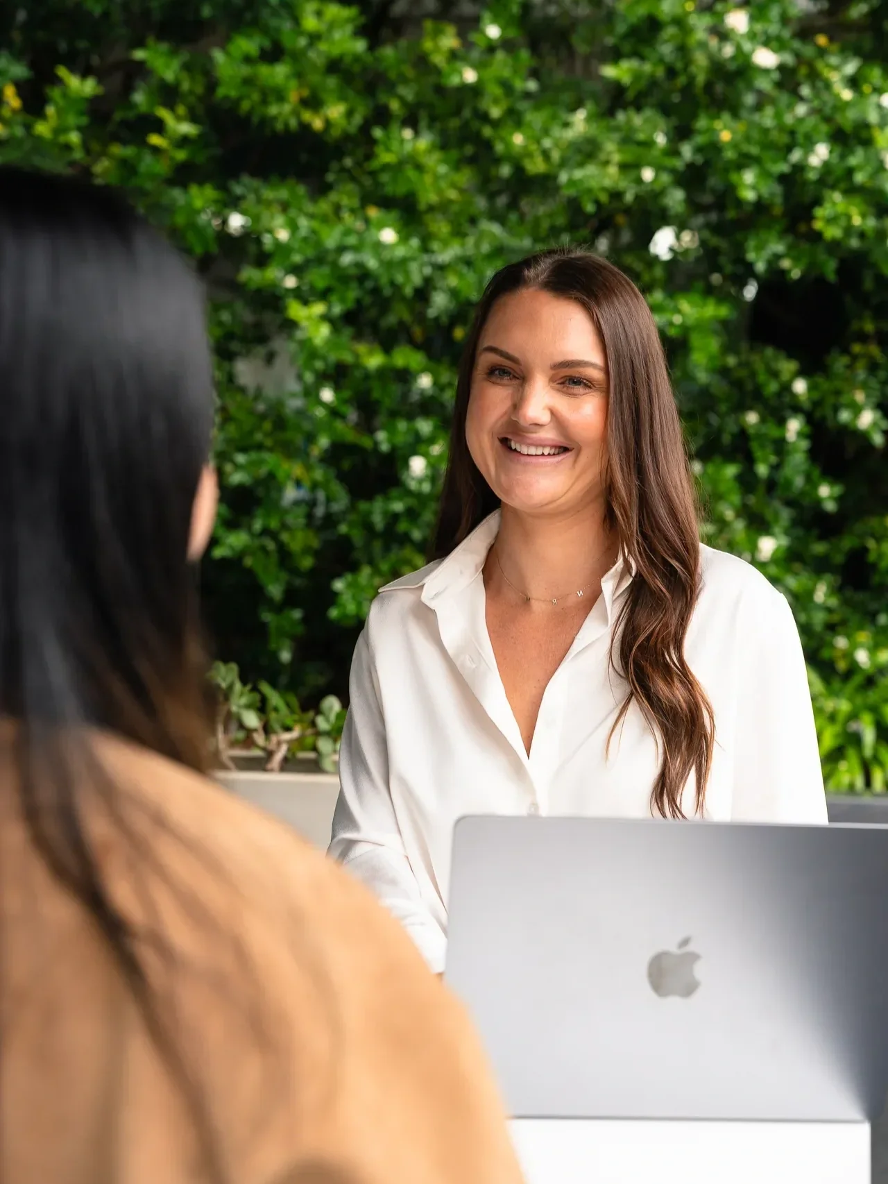 Professional headshot of a female mortgage broker in a corporate setting.