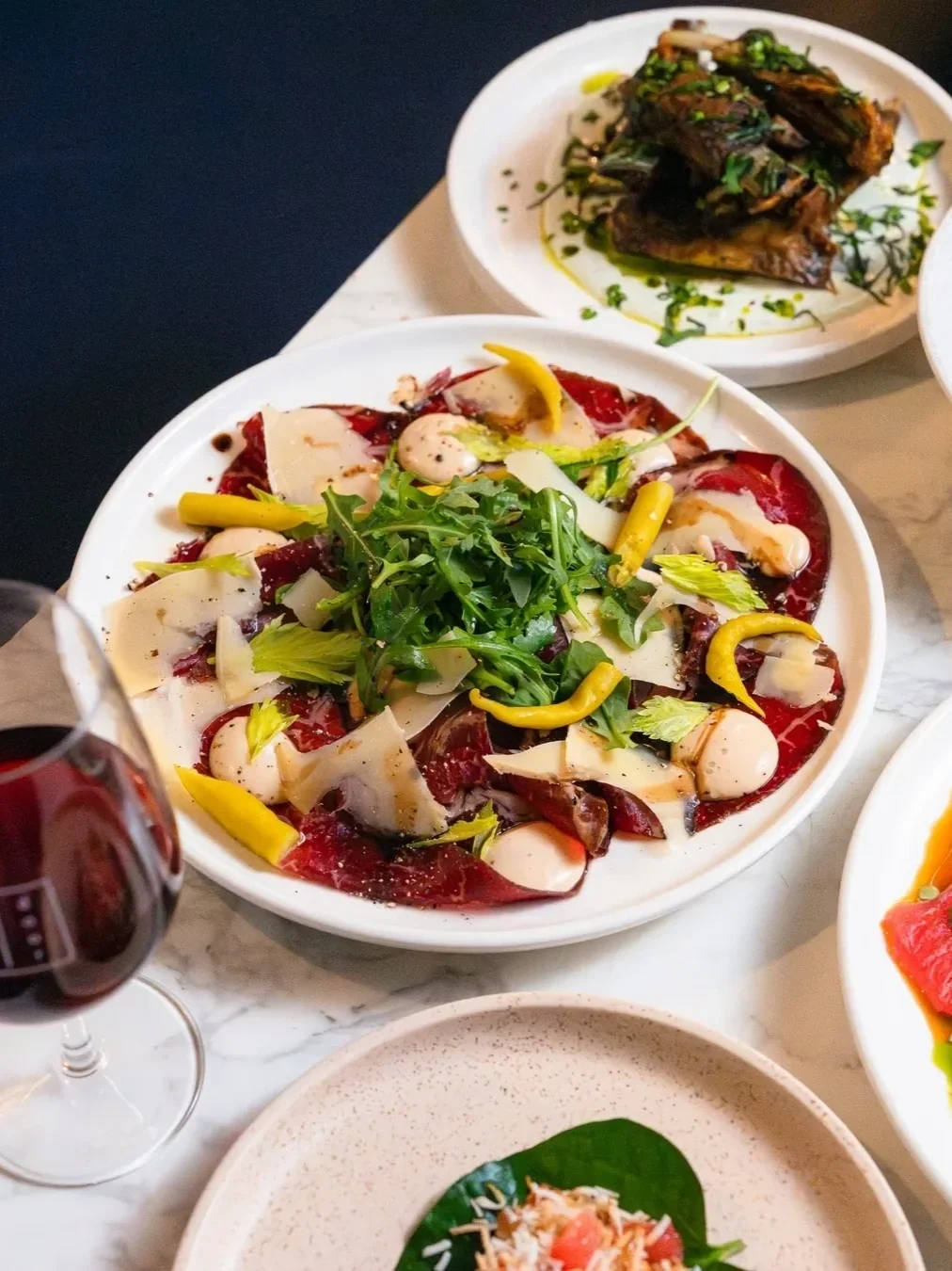 balsamic roast beets next to a glass of red wine