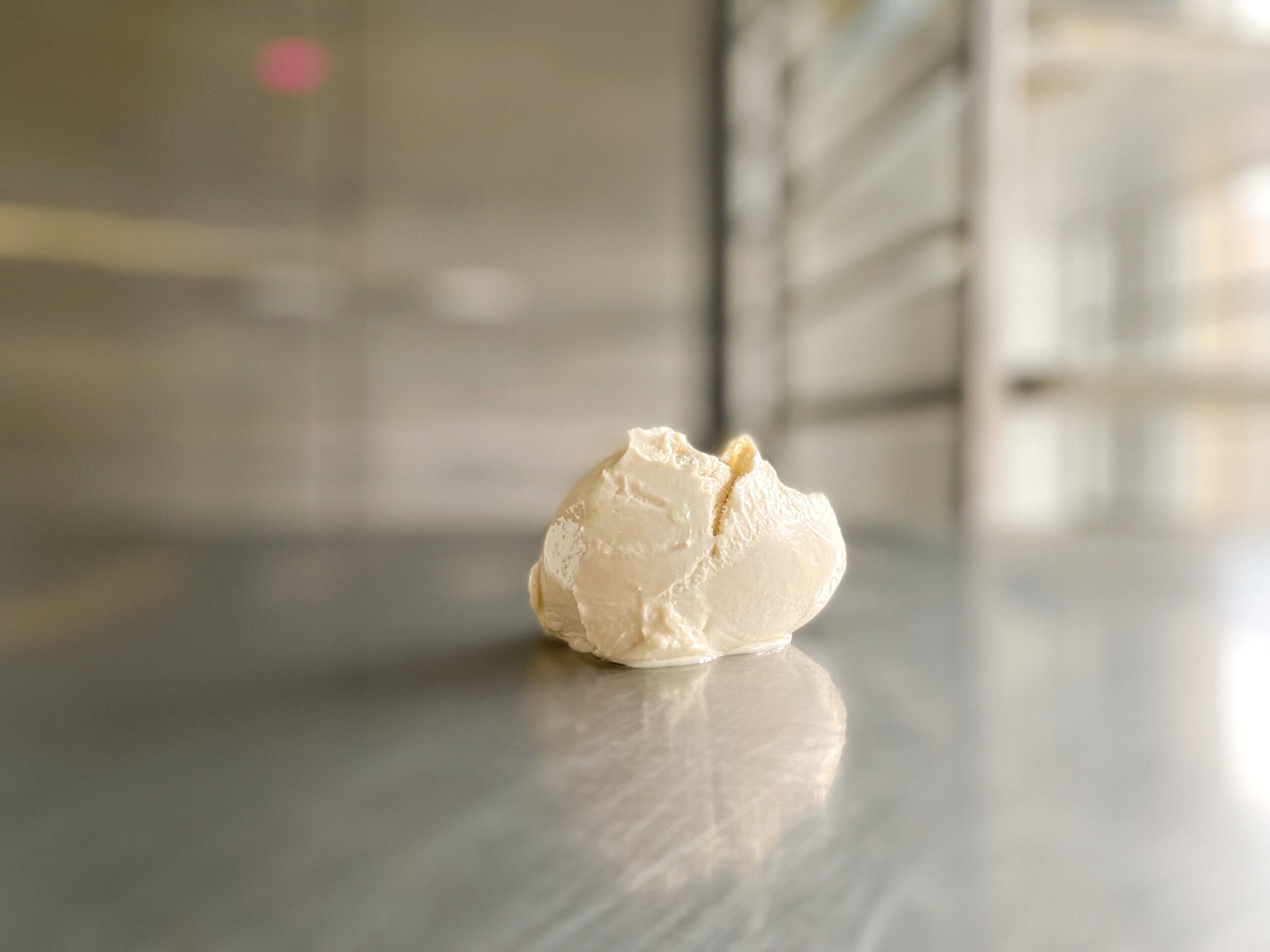 Close-up of a lump of butter in a white bowl