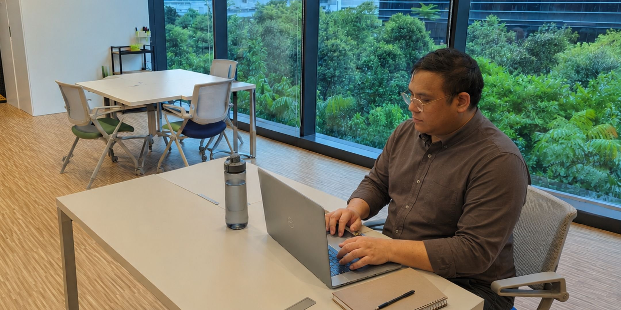 graphic designer jerome aloysius working at his desk