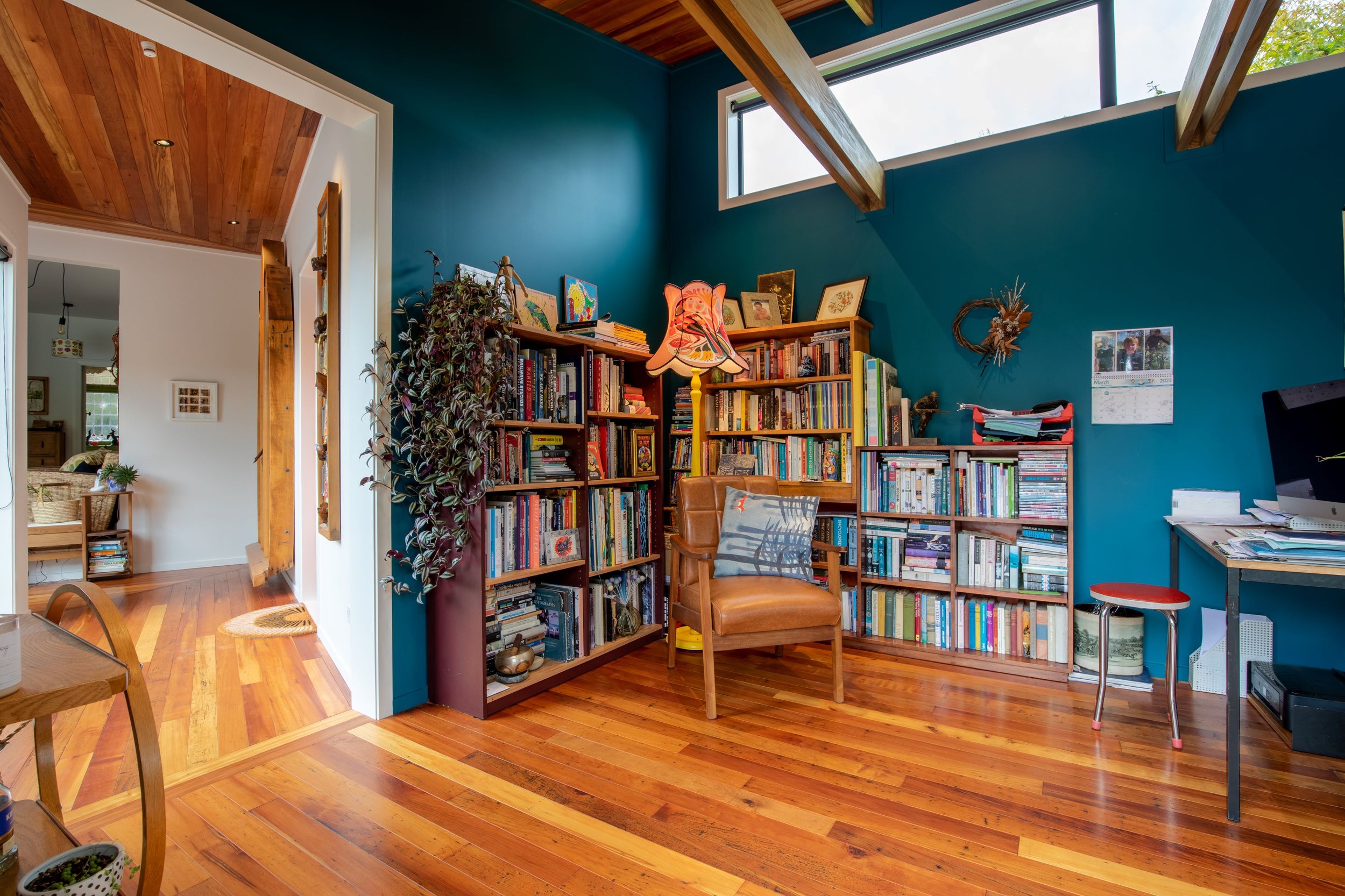 Walls in Resene Teal and a retro floor lamp in this reading corner.jpg