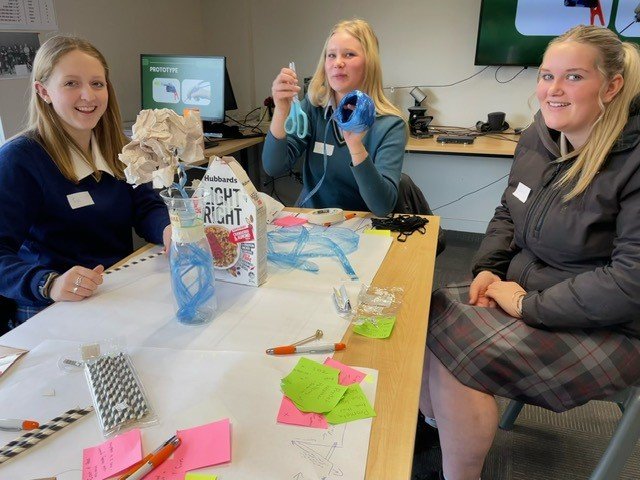 Attendees at a recent Girls Who Grow event creating a prototype of their drought solution.jpg