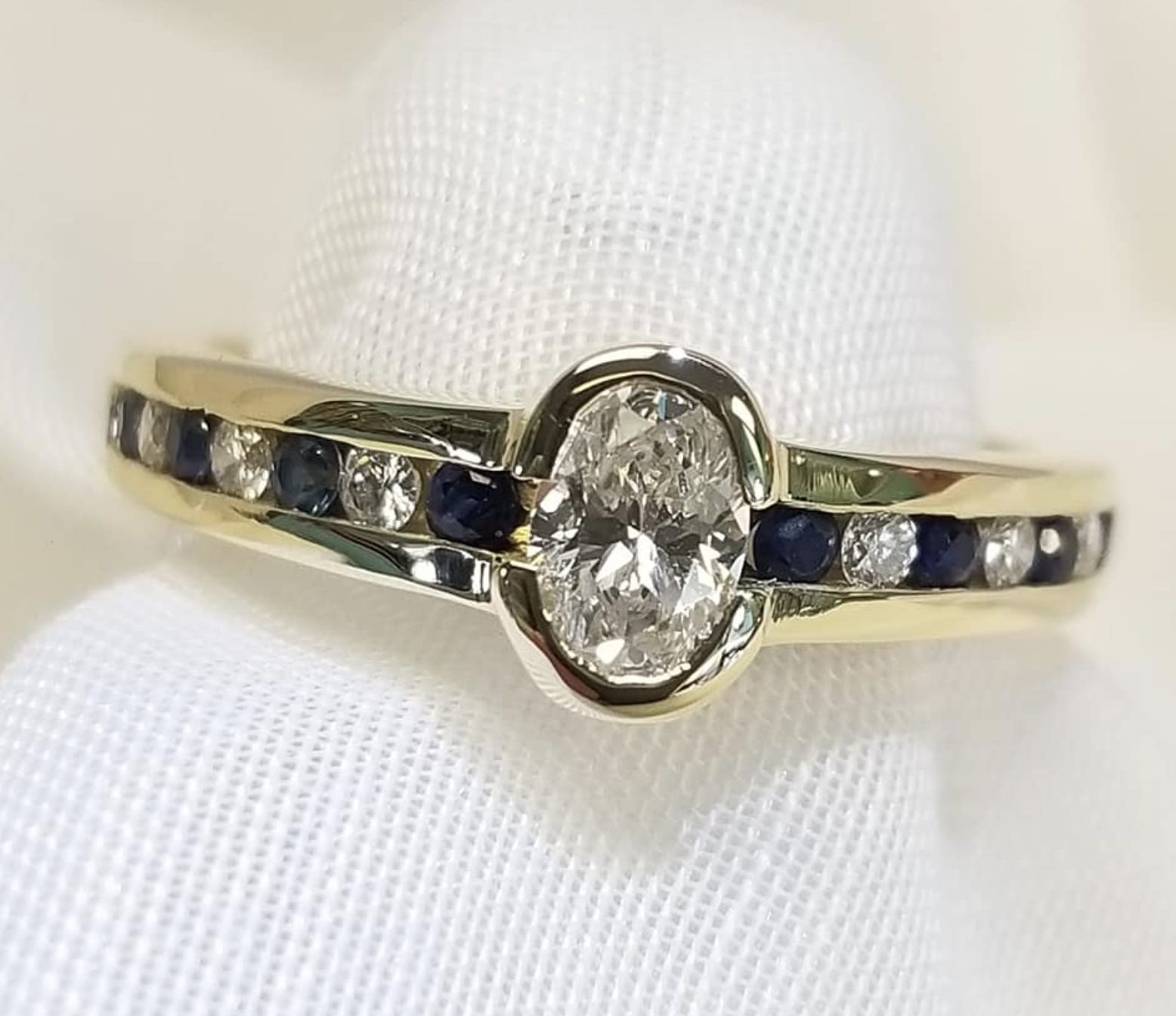 Oval Diamond with Alternating Diamonds and Sapphires