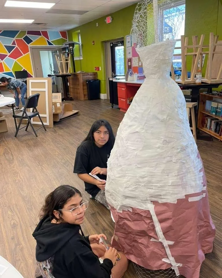 It's hard to believe our D&iacute;a de los Muertos Community Celebration is less than a month away! Here are a couple of our students working on a life-size Catrina model that will be on display during the event.

Join us at the Avondale Garage on Su