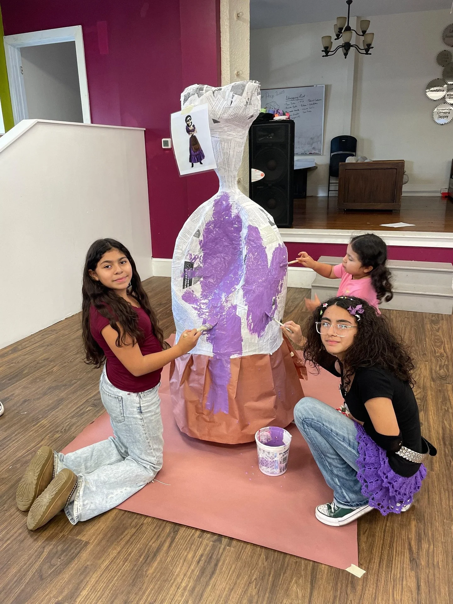 Our students (and a few bonus helpers) adding color to the members of an iconic film family that will be featured during our D&iacute;a de los Muertos Community Celebration on Sunday, November 2! Can you guess which movie the family is from? 💀🇲🇽🎨