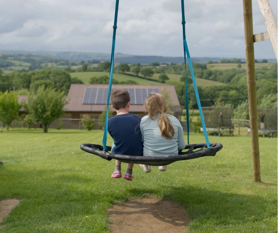 boy and girl swinging.jpg