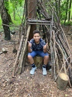 Child in Wooden Den.jpg