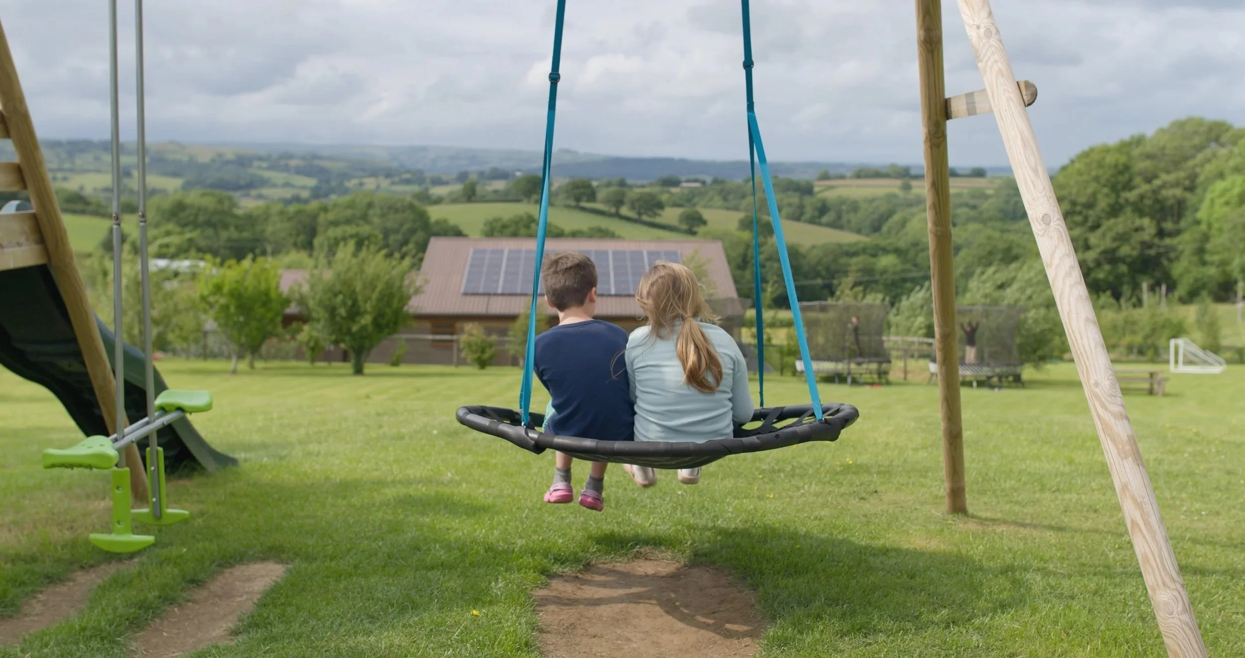 Children on swing at Pen y Bryn.jpg