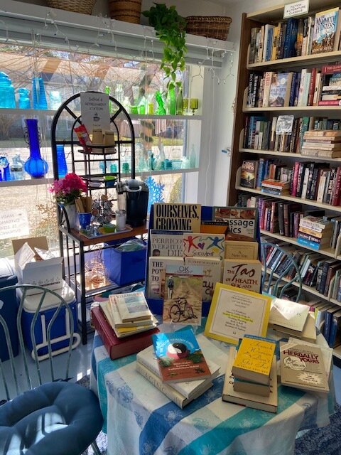  Interior of bookstore with one of the “monthly featured topics” displays and the post-COVID19 “free joe” complimentary refreshment station! 