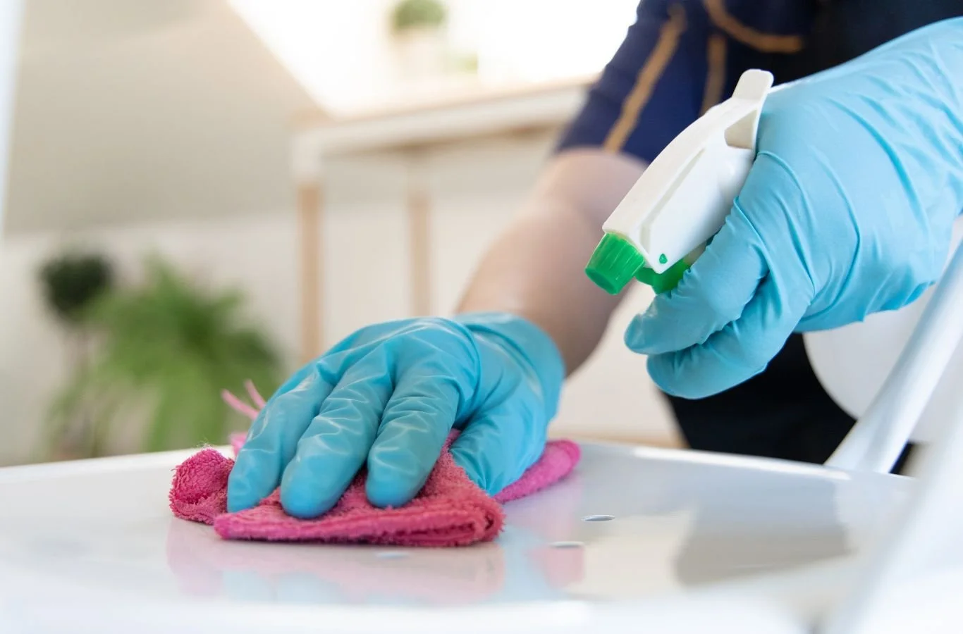 A Beyond Cleaning employee delivering spring cleaning services in Oklahoma City, OK using professional tools to refresh and deeply sanitize home interiors.