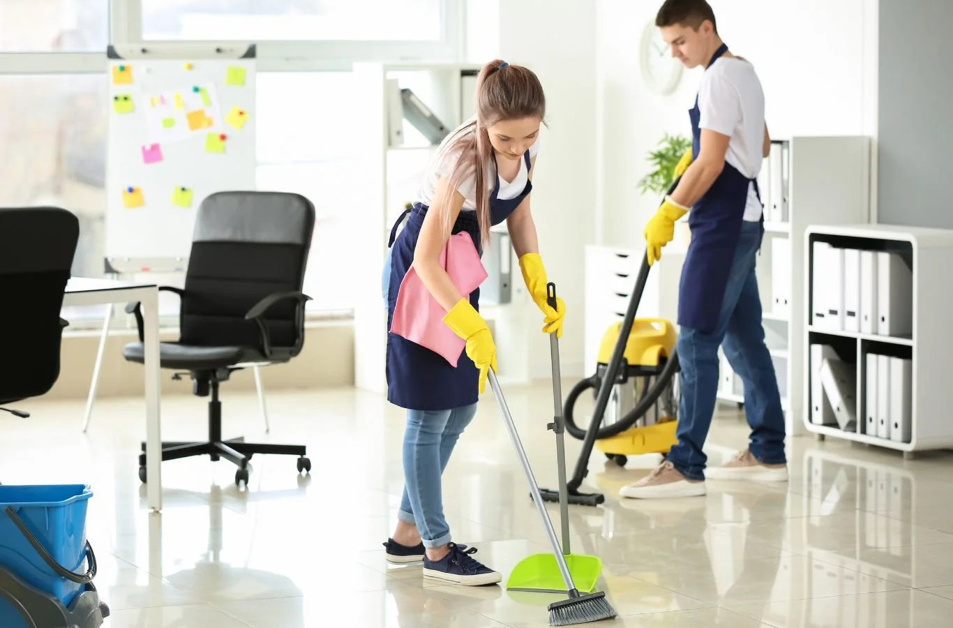 A Beyond Cleaning janitor in Moore, OK cleaning office hallways with modern tools, keeping the workspace spotless and professional.