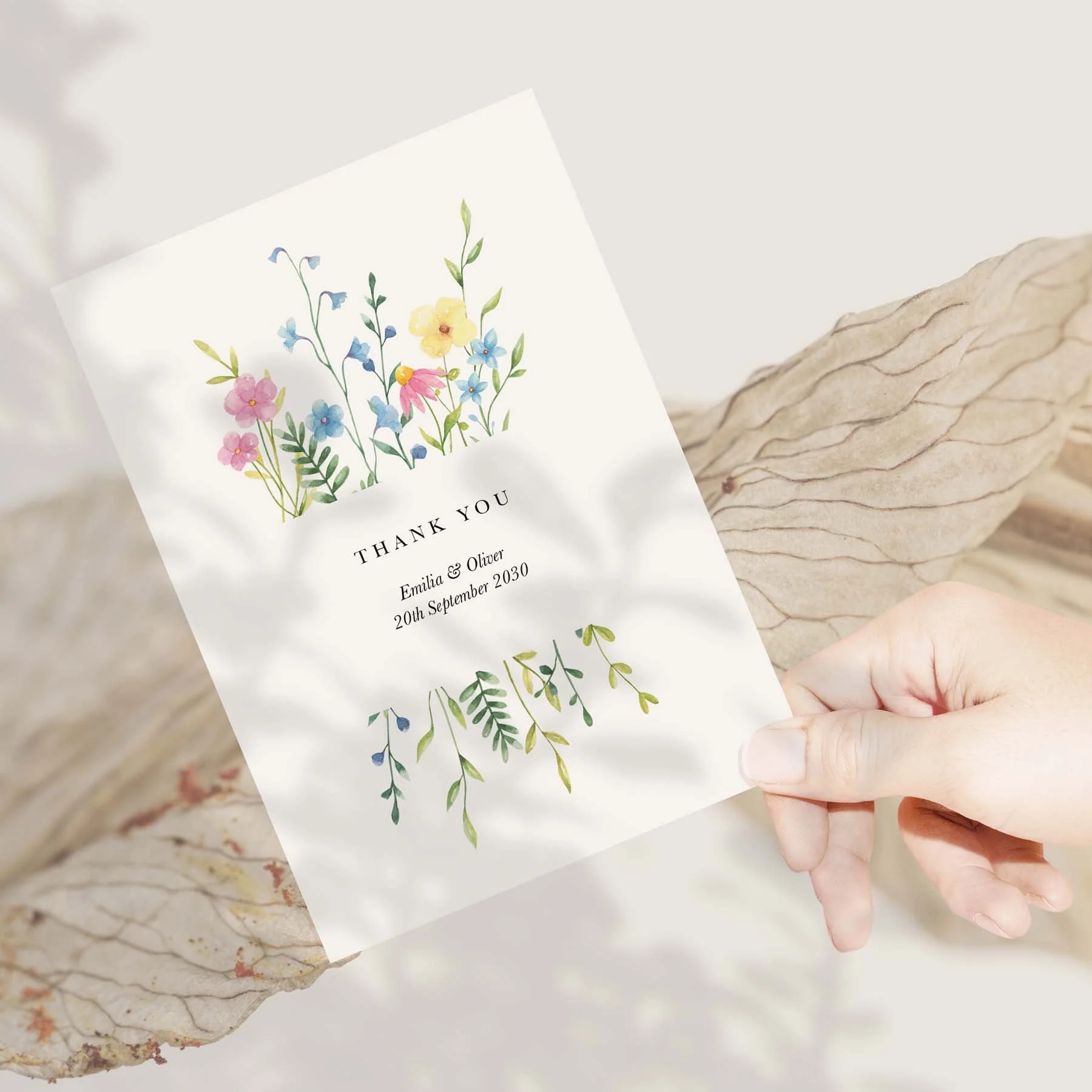 Hand holding a Wildflower wedding thank you card