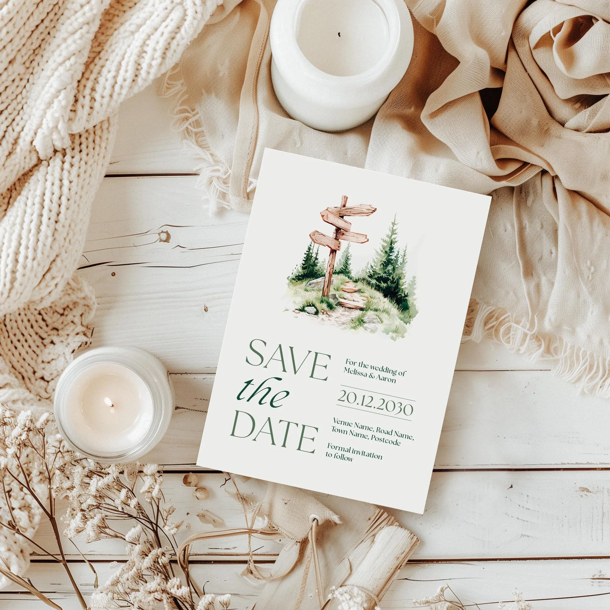 Styled flatlay of the Adventure Save the Date in an outdoorsy wedding theme.