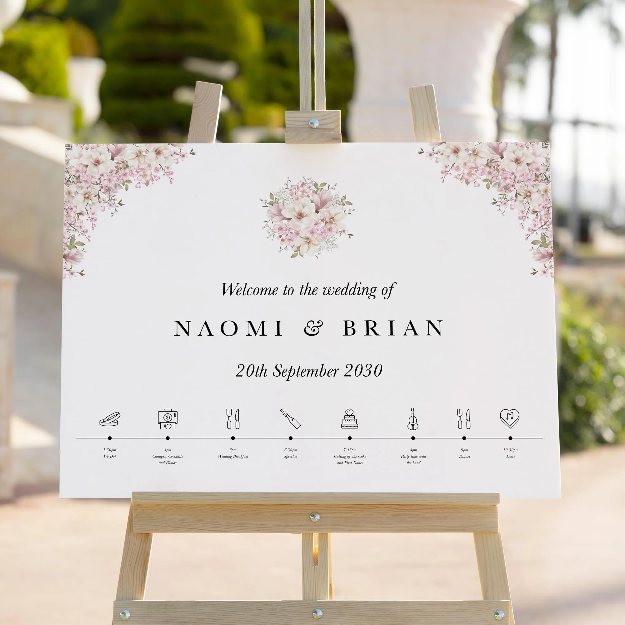 Cherry Blossom wedding welcome sign styled outdoors close-up