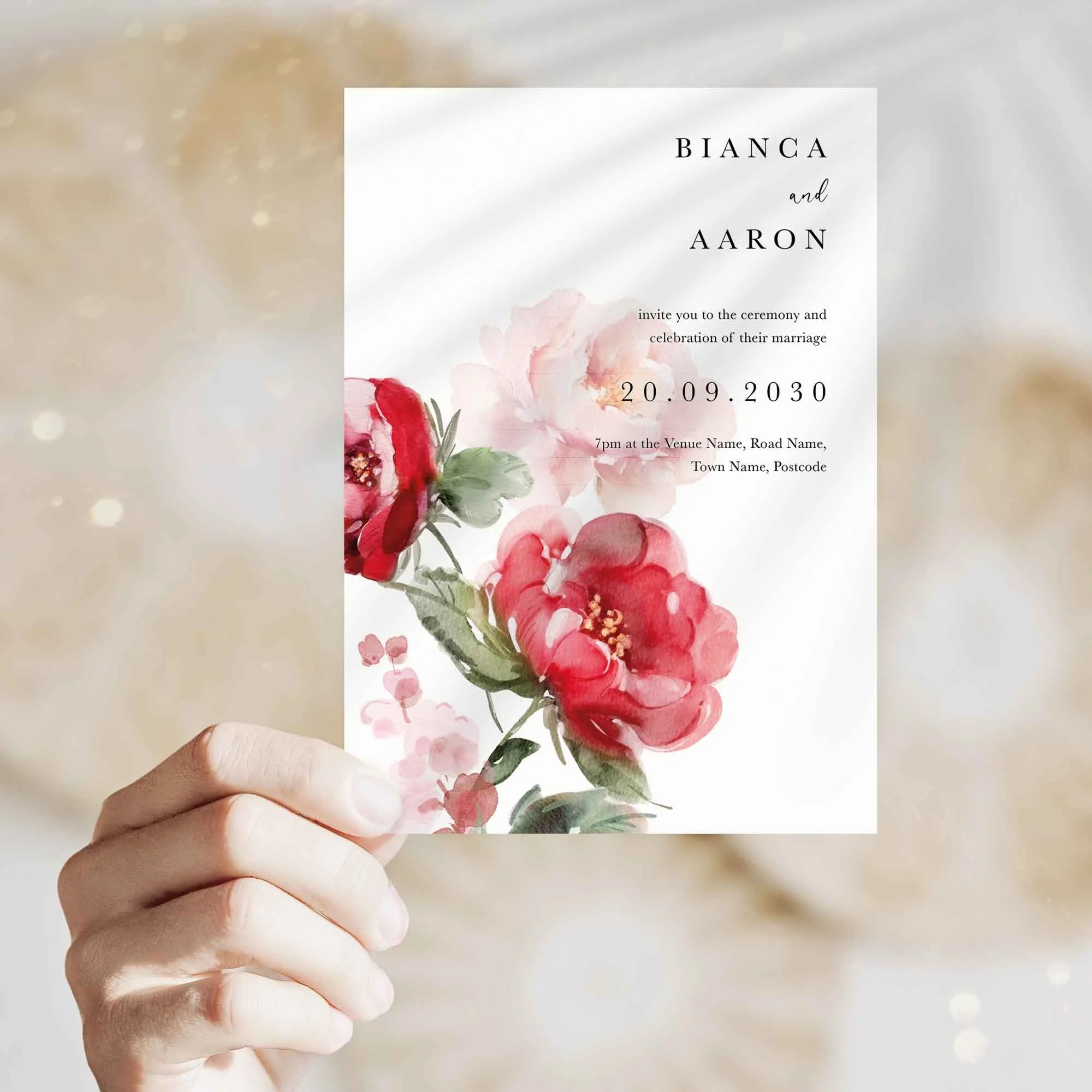 Hand holding Red Floral wedding invitation showing size and printed design details