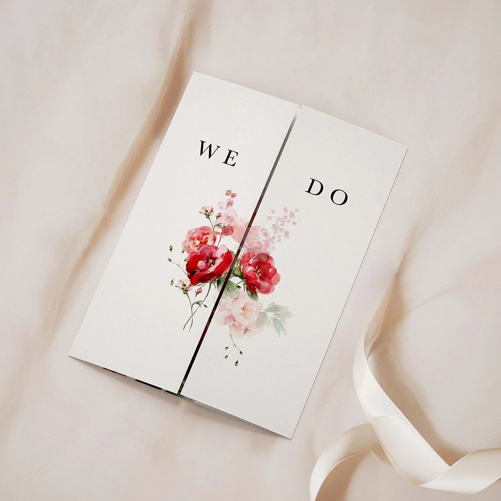Red Floral Frame gatefold wedding invitation closed, featuring a vivid red and blush pink floral frame around central wedding text.