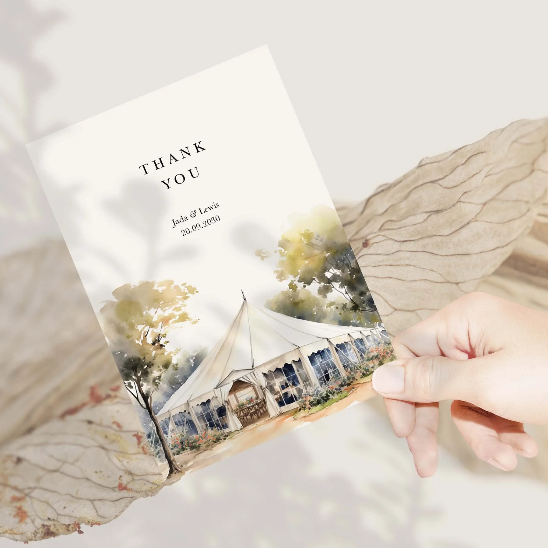 Hand holding a Bell Tent wedding thank you card