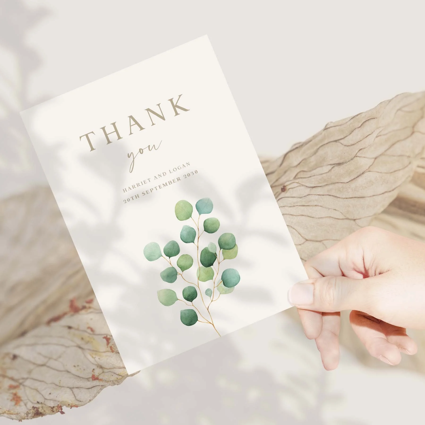 Hand holding a Eucalyptus Foliage wedding thank you card