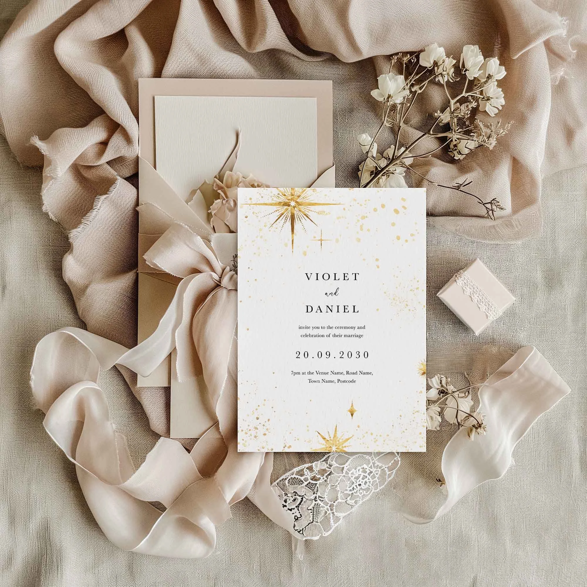 Celestial wedding invitation styled in a flat lay environment with wedding props