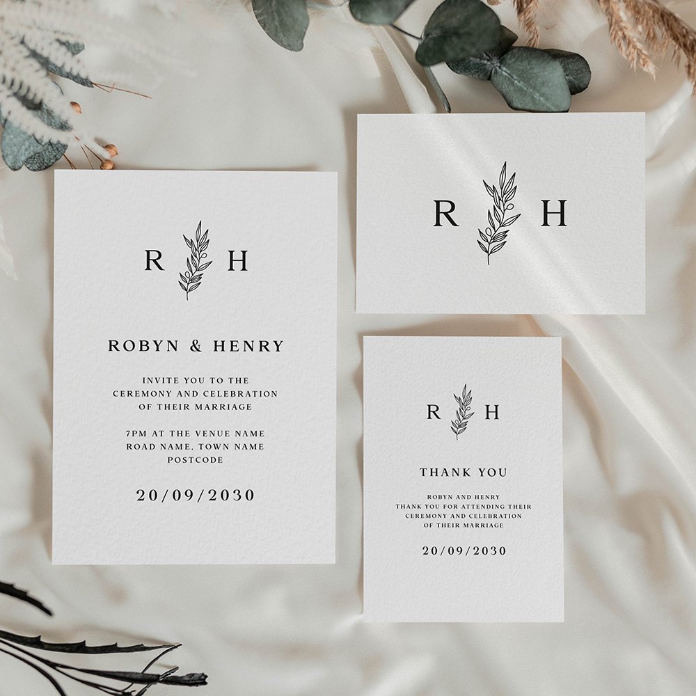 Modern monogram save the date in black and white with a simple olive branch between initials, displayed in clean horizontal layout