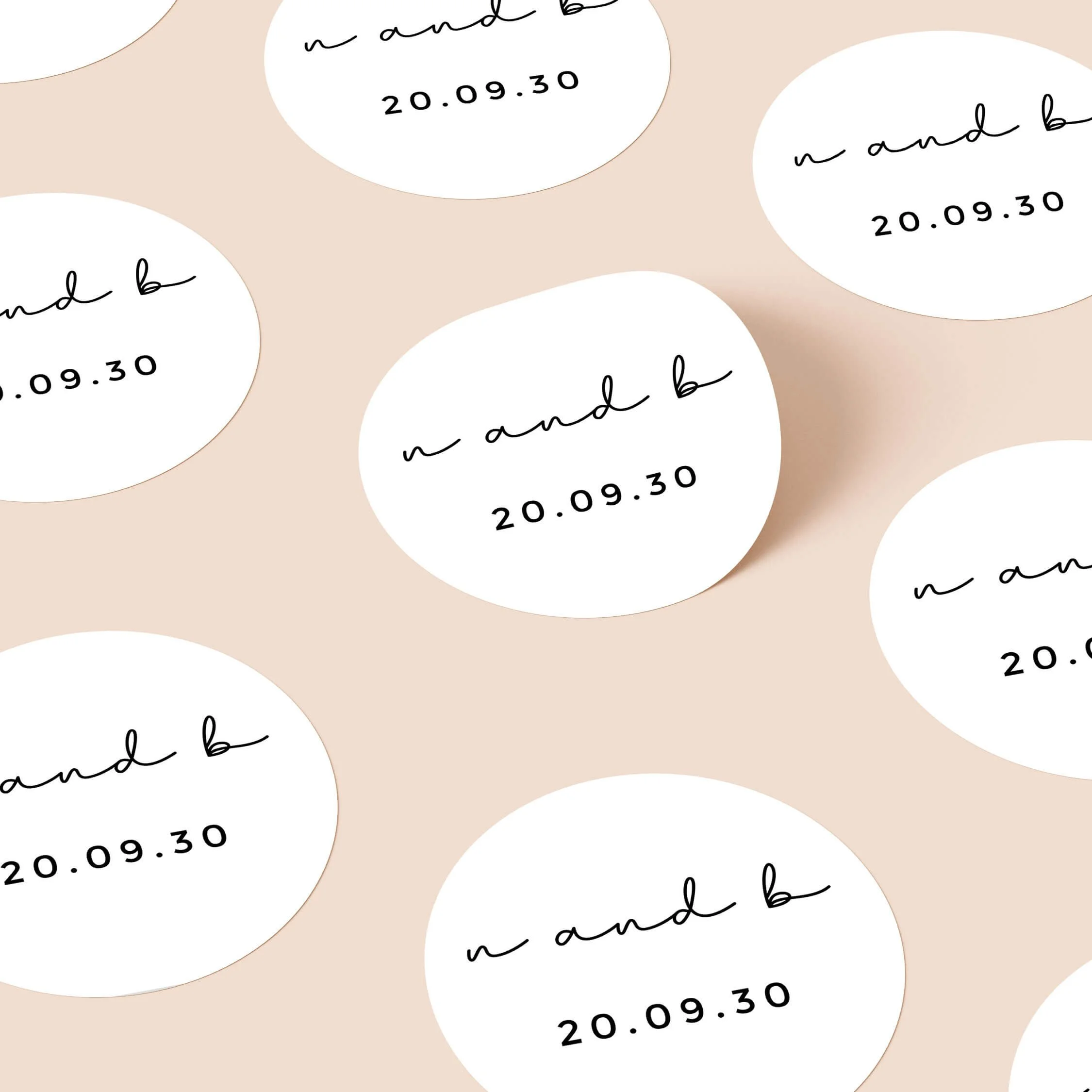 Classic wedding stickers with clean typography and initials repeated on personalised round seals