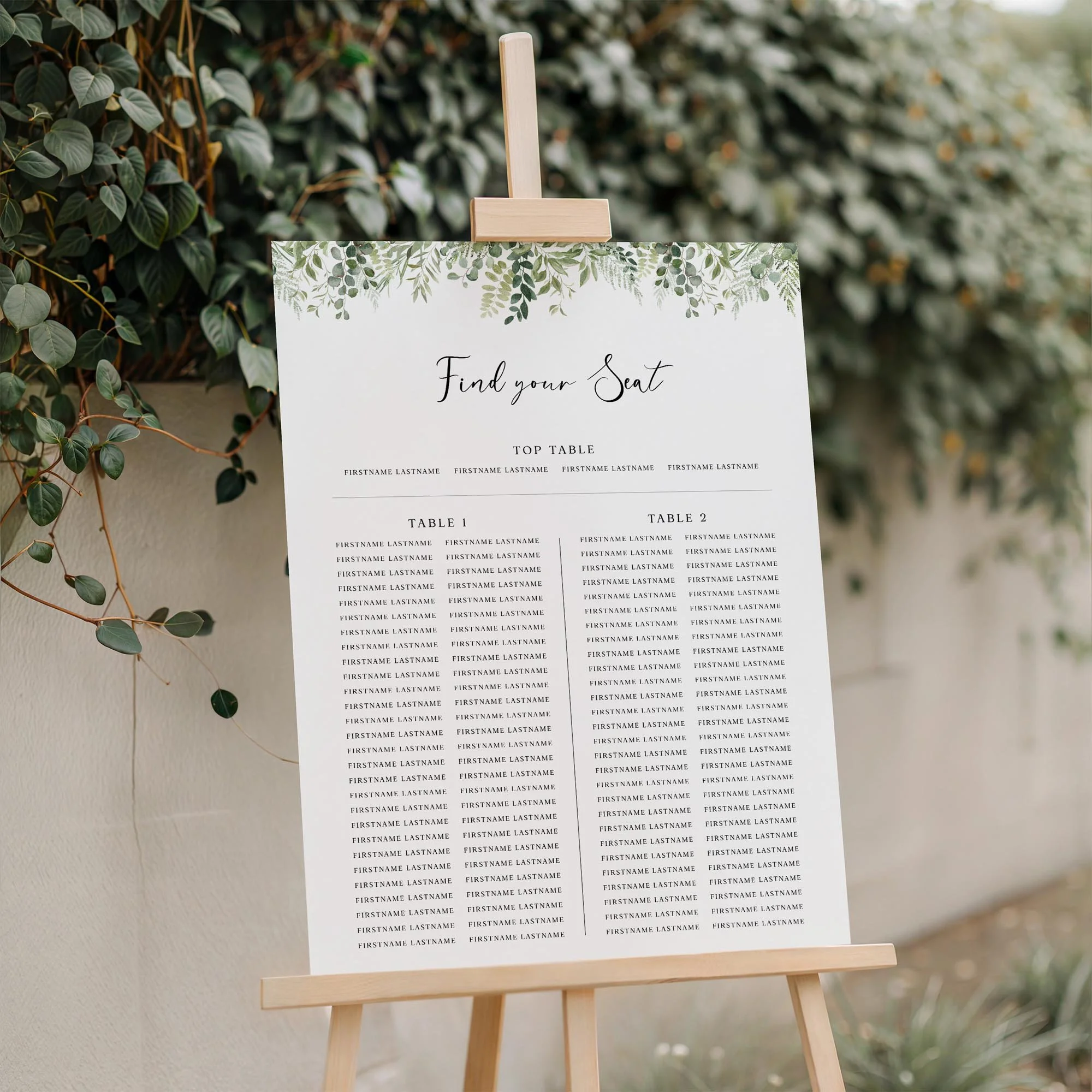 Close-up of the Greenery wedding Trestle seating plan board displayed outdoors