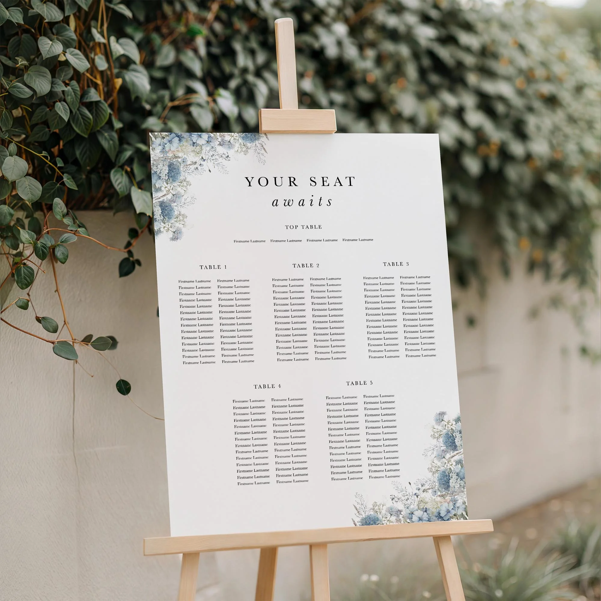 Close-up of the Dusty Blue wedding seating plan board displayed outdoors