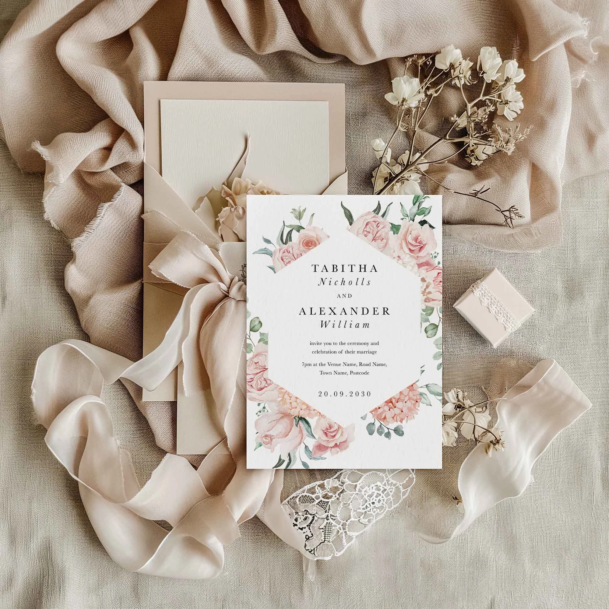 Blush Pink Peony wedding invitation styled in a flat lay environment with wedding props