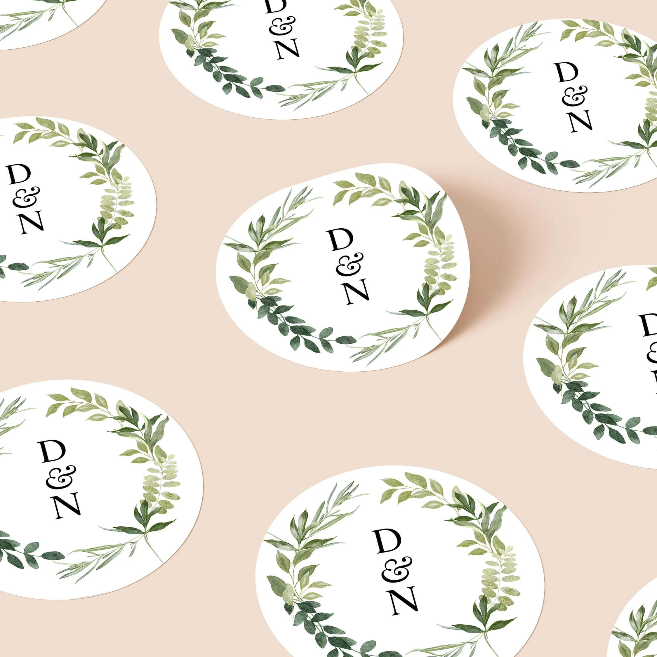 Greenery personalised wedding stickers with soft botanical foliage wreath and elegant initials on round stickers