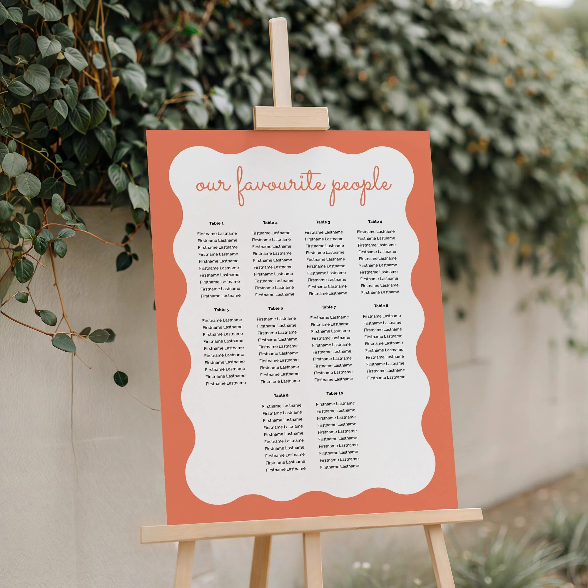 Close-up of the Orange Coloured Wavy Border wedding seating plan board displayed outdoors