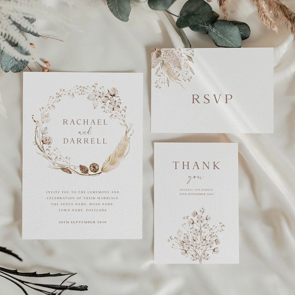 Boho Collection wedding stationery set including flat invitation, RSVP card, and thank you card featuring neutral brown dried florals, pampas grass, and cotton details.