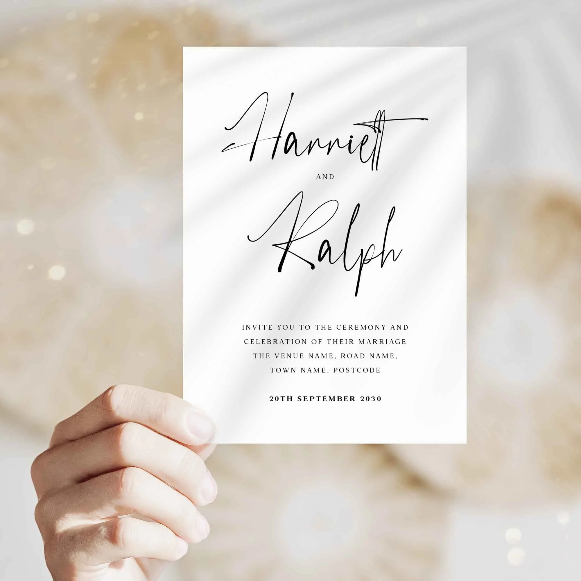Hand holding Black and White wedding invitation showing size and printed design details