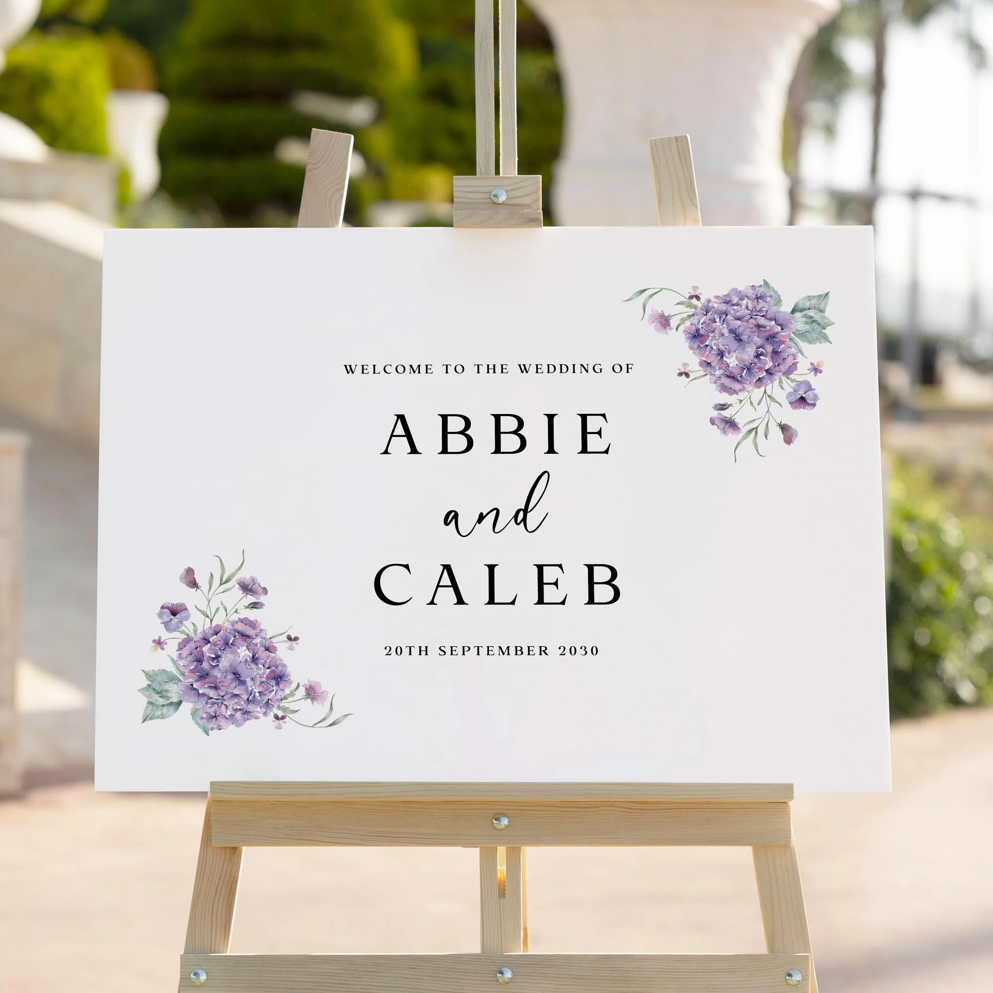 Purple Hydrangea wedding welcome sign styled outdoors close-up