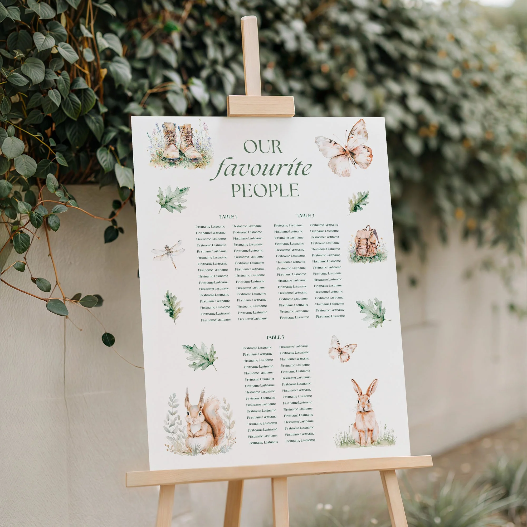 Adventure wedding seating plan displayed on a wooden easel, featuring a forest green outdoor adventure design with multiple guest tables