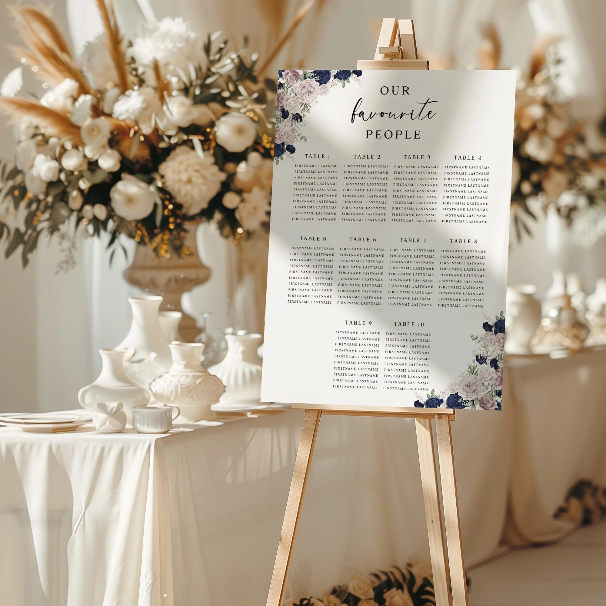 Navy Blue and Blush Pink Floral wedding seating chart sign styled at a reception