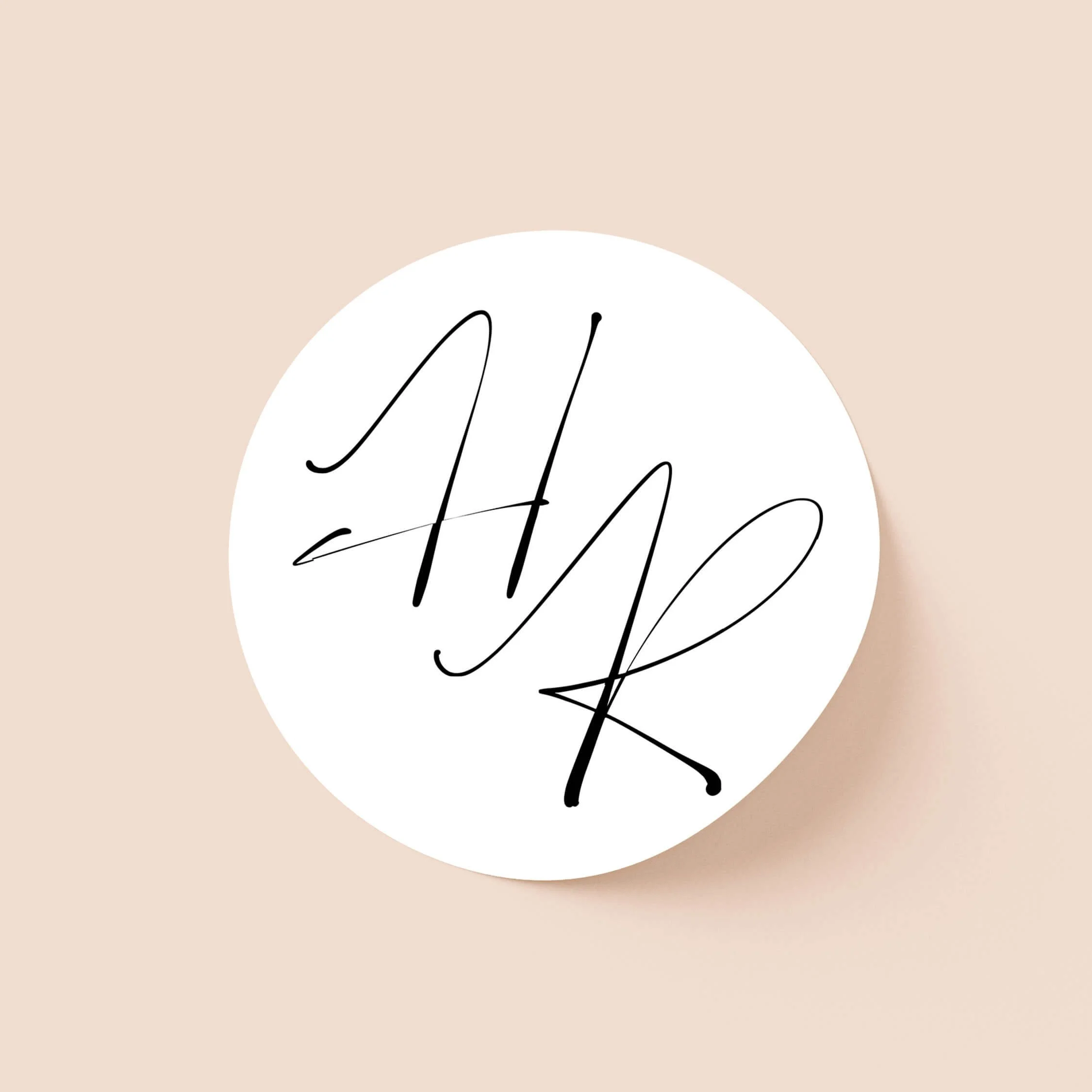 Autograph wedding sticker with bold handwritten initials on round sticker
