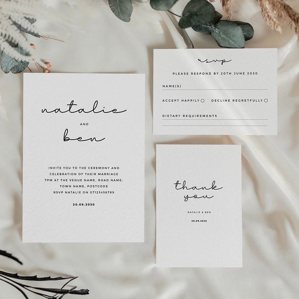 Minimal black and white wedding stationery featuring a hand written typeface.