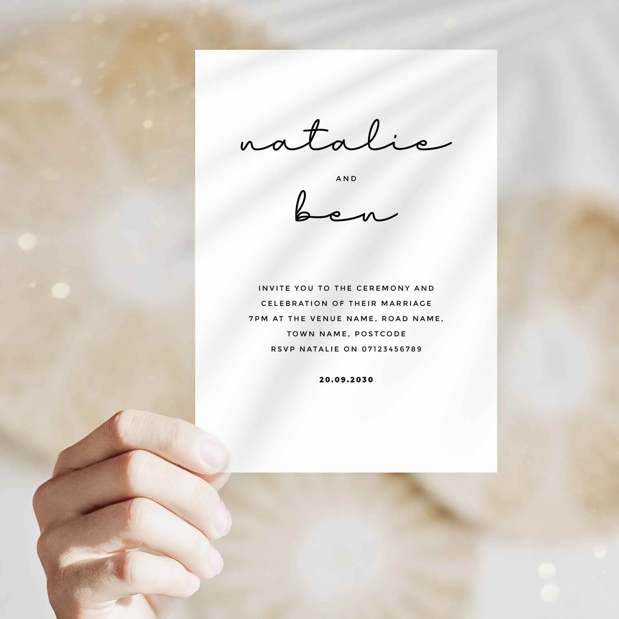 Hand holding Classic wedding invitation showing size and printed design details