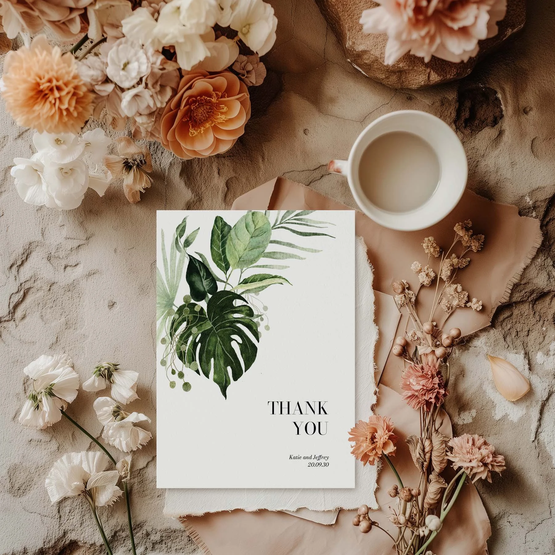 Tropical Leaves wedding thank you card styled with flowers and stationery details