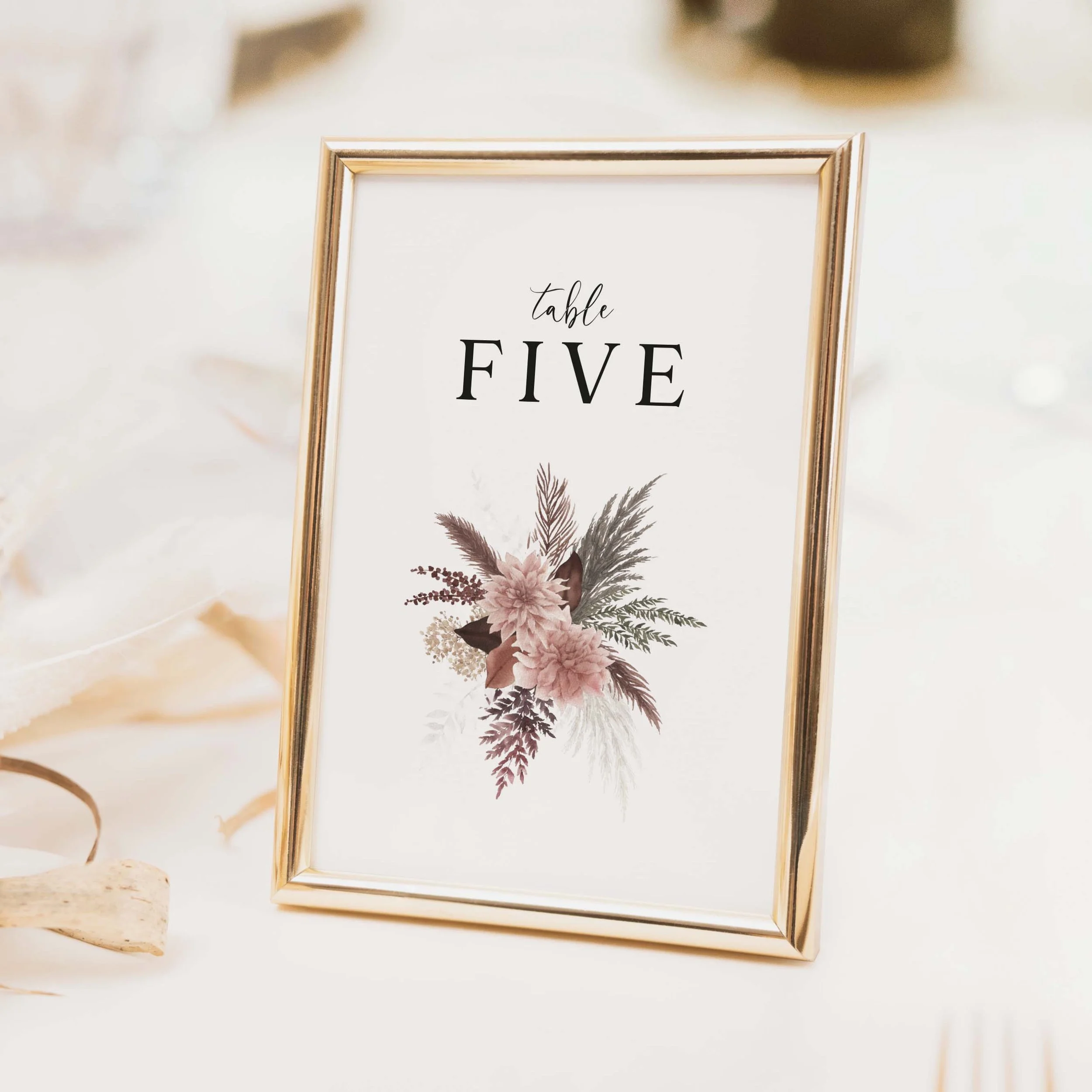 Blush Boho wedding table number with dried grass and botanical foliage illustration in dusty pink and mauve tones with script typography printed on luxury off-white textured card