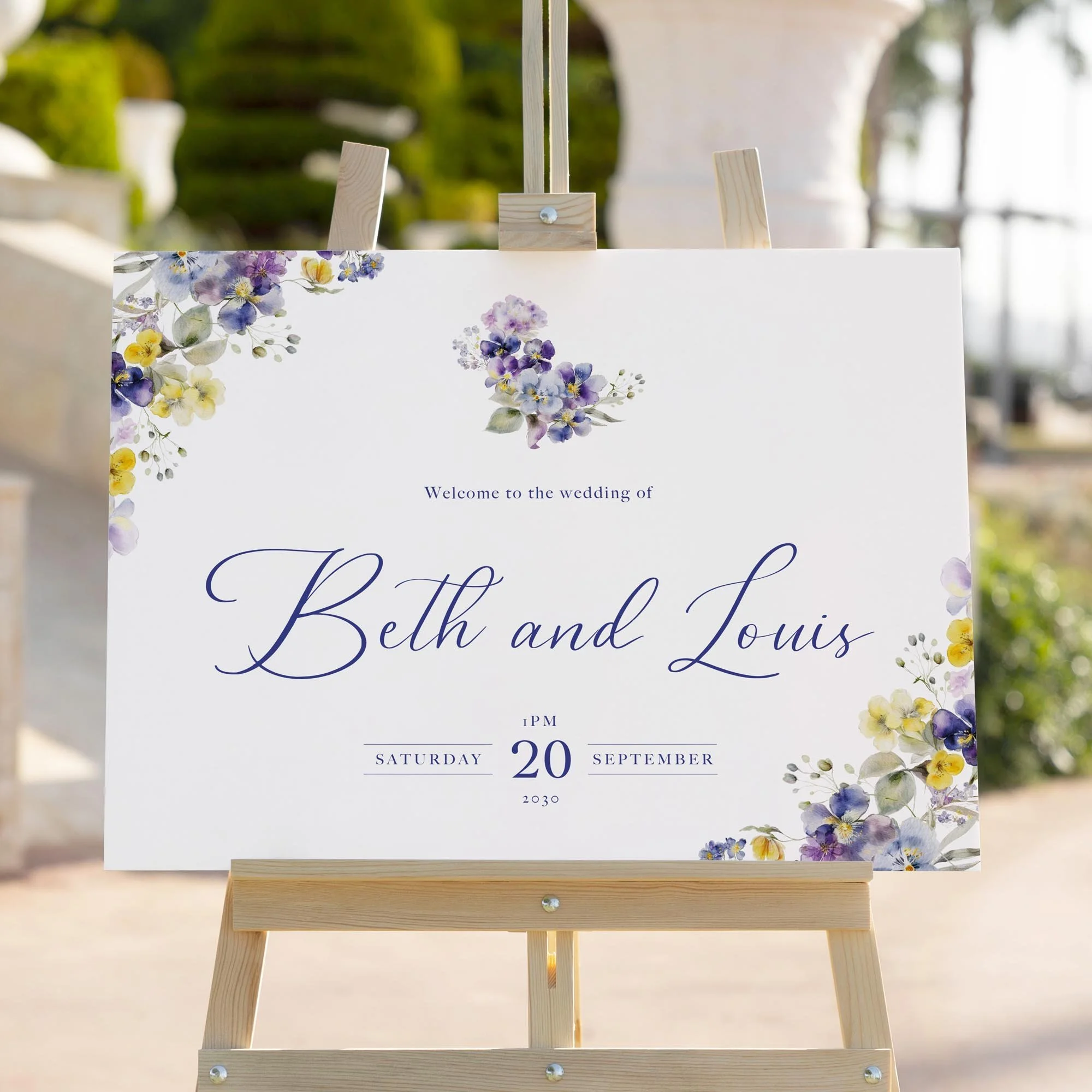 Violet and Yellow Floral wedding welcome sign styled outdoors close-up