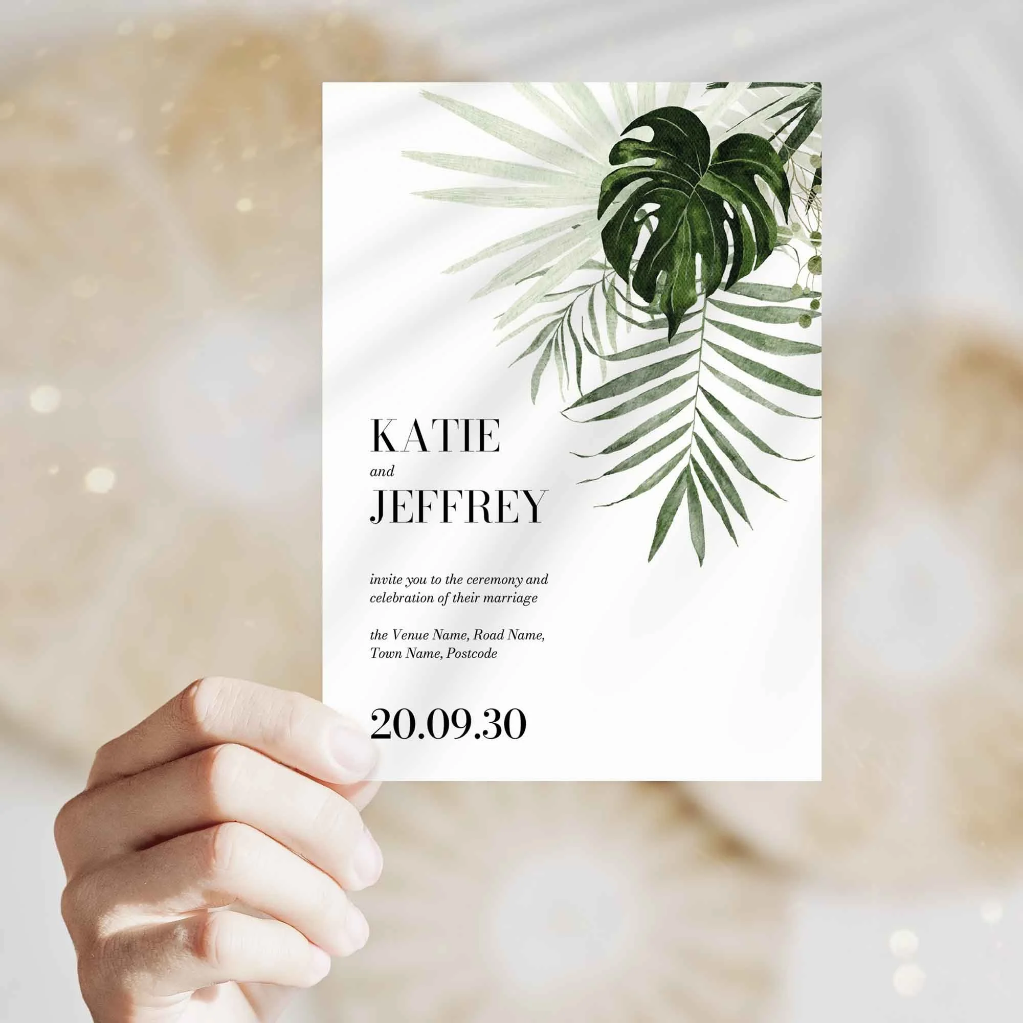 Hand holding Tropical Leaves wedding invitation showing size and printed design details