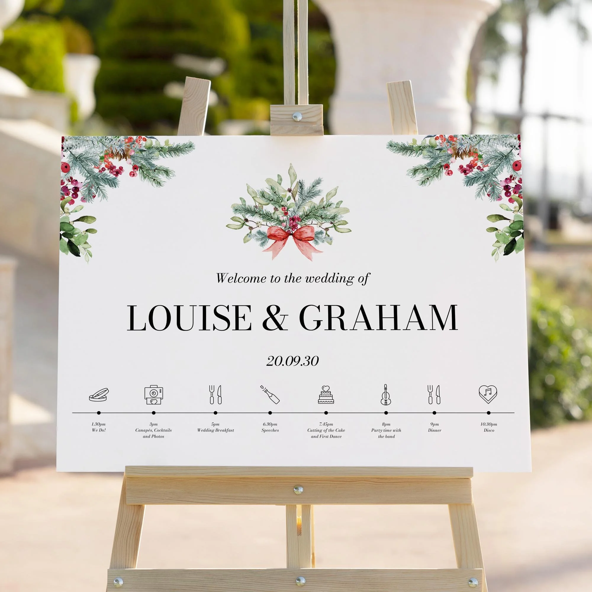 Winter Greenery Theme wedding welcome sign styled outdoors close-up